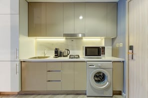 Fridge, microwave, coffee/tea maker, toaster - Chic Studio l Private Balcony l Close to Landmarks (Meydan)