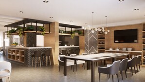 A modern kitchen with a central island, bar area, and wine rack. - Empire Hotel Buenos Aires (Buenos Aires)