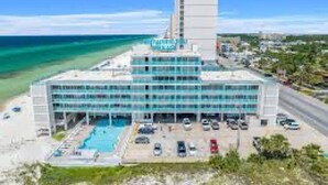 A modern hotel with a pool, located near a beach. - 308 Beachfront Condo with Pool Sunset Views (panama city beach)