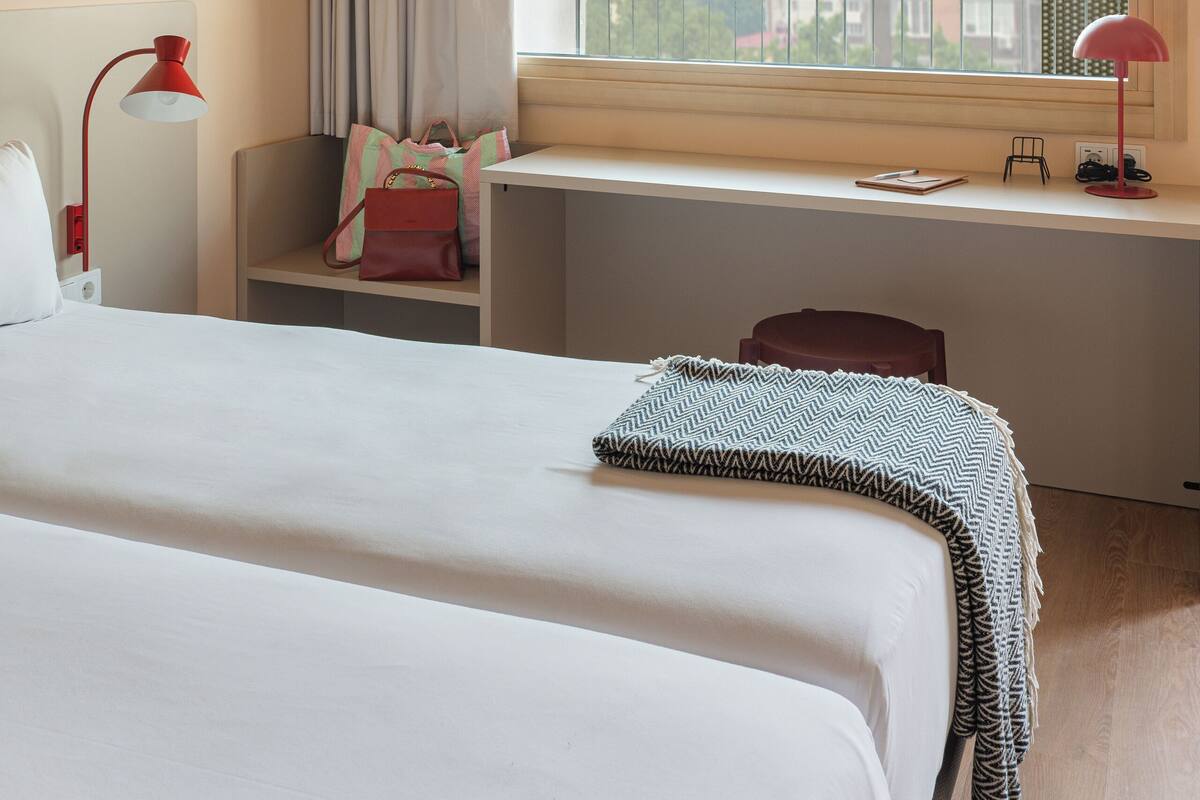 Premium bedding, down comforters, in-room safe, desk