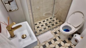 Shower, hair dryer, towels, soap