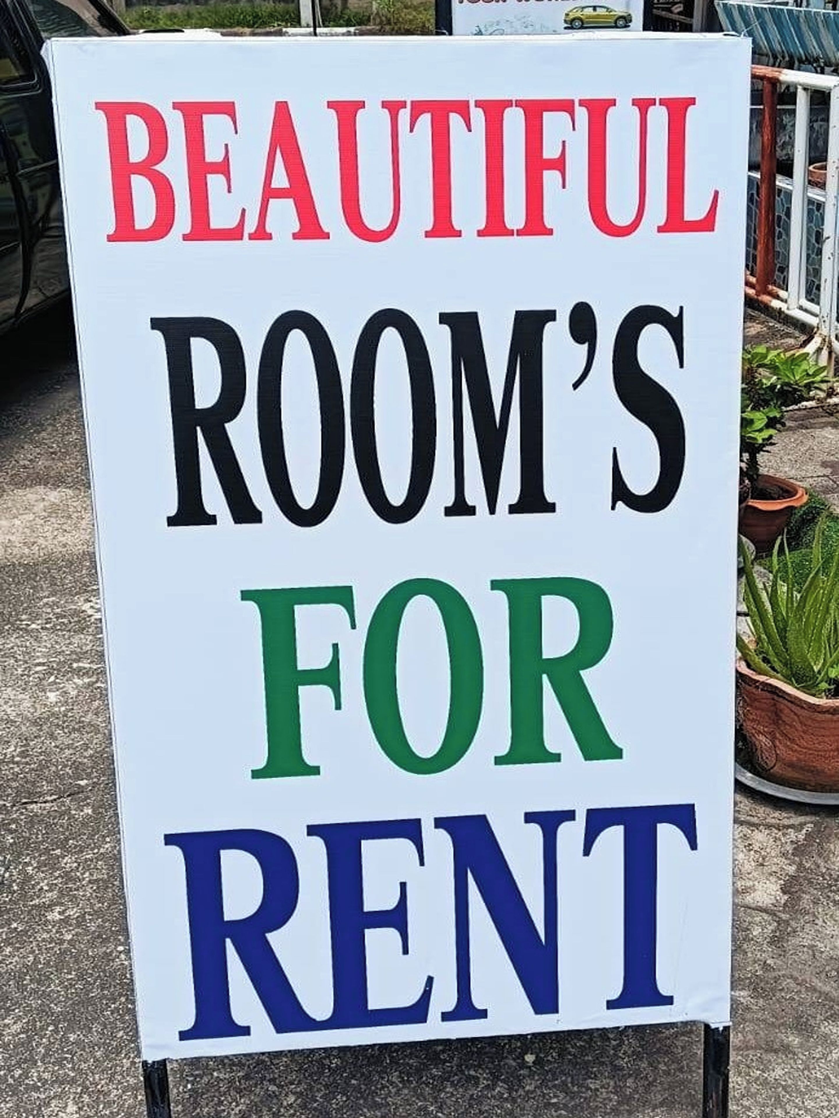 A sign advertising a room for rent.