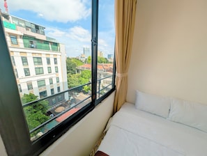 Deluxe Double Room, City View | Minibar, blackout drapes, free cribs/infant beds, rollaway beds