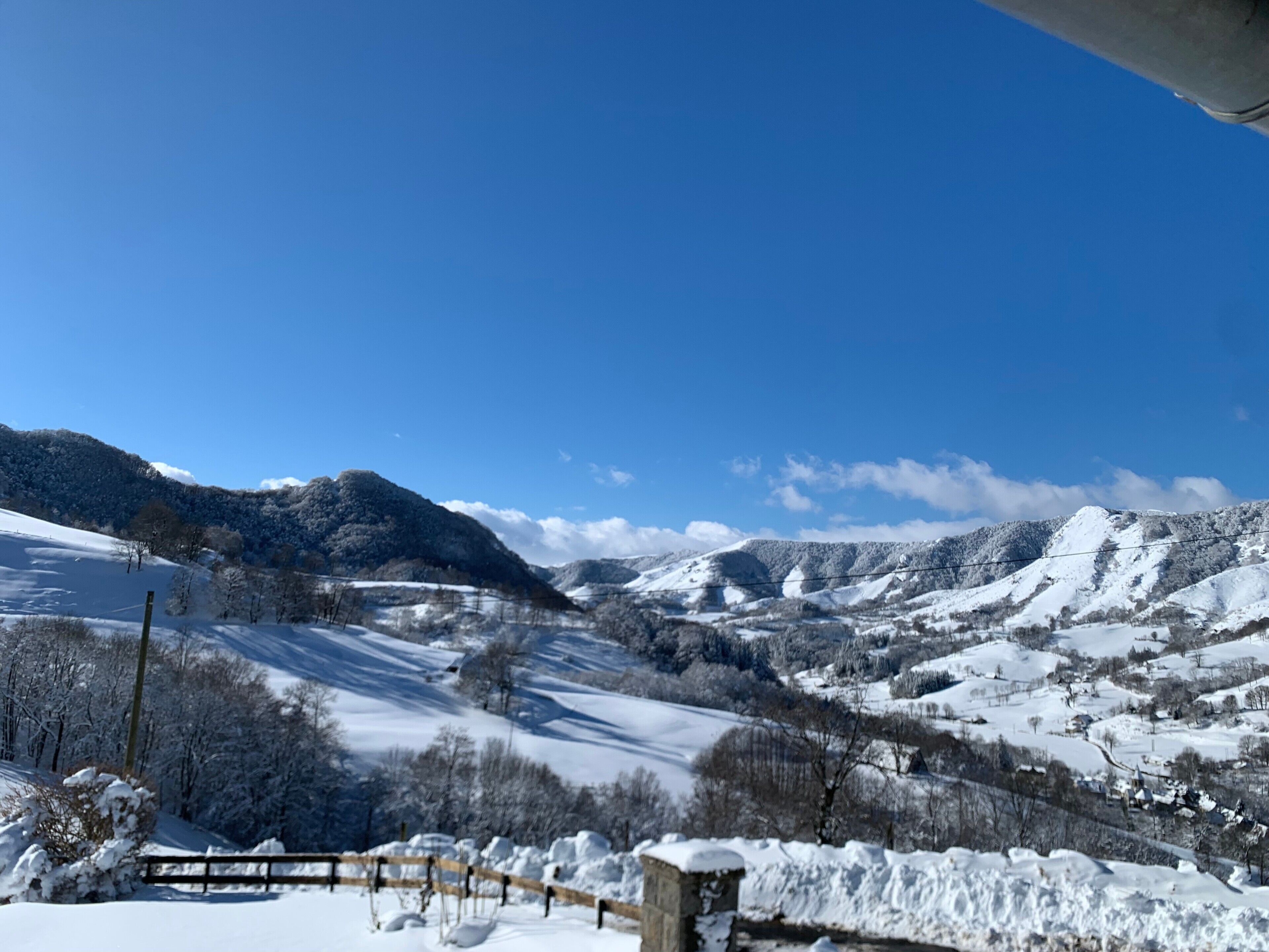 A snowy mountain landscape with a clear sky.