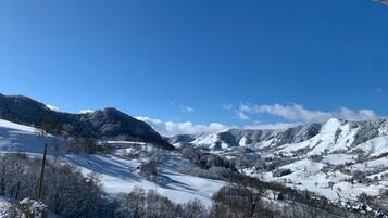 A snowy mountain landscape with a clear sky.