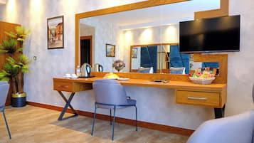Family Suite, City View | In-room safe, desk, laptop workspace, blackout drapes
