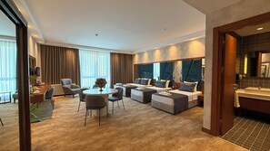Family Suite, City View | In-room safe, desk, laptop workspace, blackout drapes