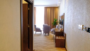 Family Twin Room, City View | In-room safe, desk, laptop workspace, blackout drapes