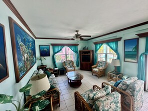 Condo, Air conditioning, Beach View | Living area | 32-inch TV with cable channels