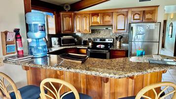Signature Condo, Air conditioning, Beach View | Private kitchen | Full-size fridge, microwave, oven, stovetop