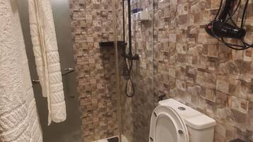 Shower, hair dryer, towels, soap