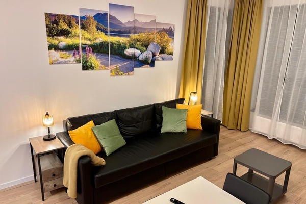 Living room with kitchen, blackout curtains, exterior blinds, DVD, cable 65in TV