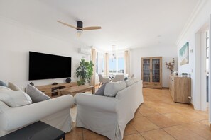 TV, fireplace - Villa 'Rafael' with Sea View, Wi-Fi and Air Conditioning (Sant Lluís)