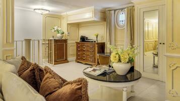 A well-lit living room with a sofa, a coffee table, and a cabinet.