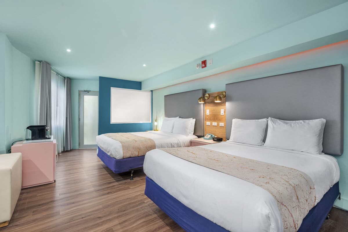 Junior Suite, 2 Queen Beds | Pillowtop beds, in-room safe, blackout drapes, iron/ironing board