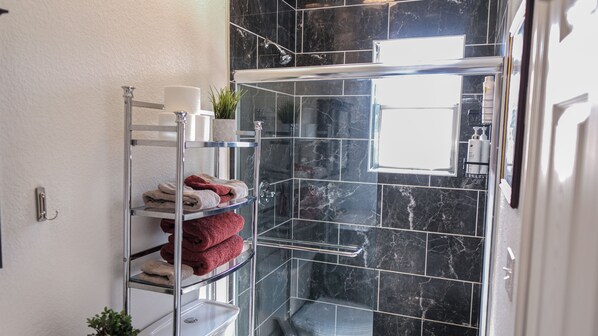 Shower, hair dryer, towels, soap