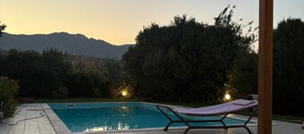 Villa surrounded by greenery nestled on the hillside