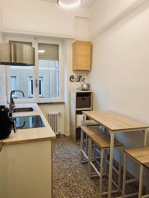 Fridge, microwave, stovetop, coffee/tea maker