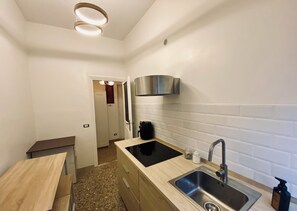 Fridge, microwave, stovetop, coffee/tea maker