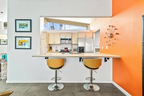 Fridge, microwave, oven, stovetop - Relax at Port Palm Springs, a spacious 3BR retreat with vaulted ceilings, lagoon views, 3 patios, pools & hot tubs. Perfect for families, friends, or couples looking for comfort, charm & Palm Springs magic. (Palm Springs)