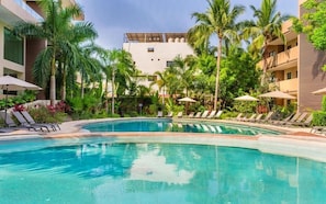 Outdoor pool, open 9:00 AM to 9:00 PM, pool umbrellas, sun loungers