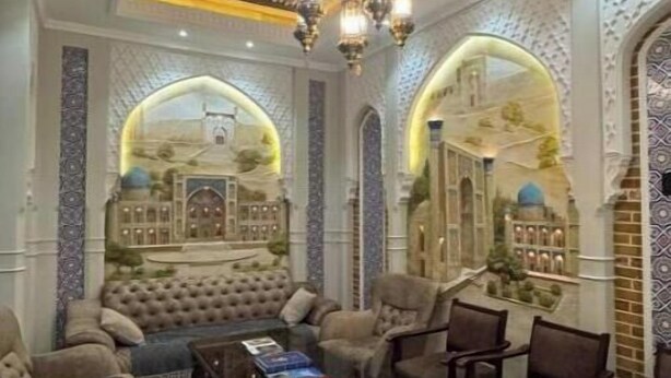 A luxurious living room with a plush sofa, a coffee table, and several armchairs. - Old City Samarkand Hotel Superior Triple Room (Samarkand)