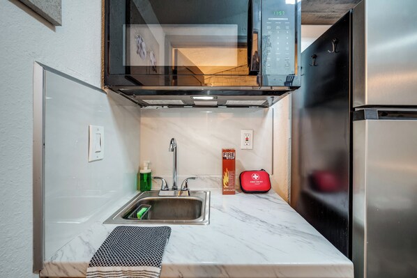 Fridge, microwave, toaster, cookware/dishes/utensils