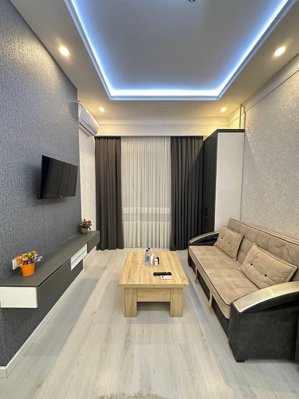 Comfort Apartment, Balcony, Garden View | Living area | 42-inch LED TV with digital channels