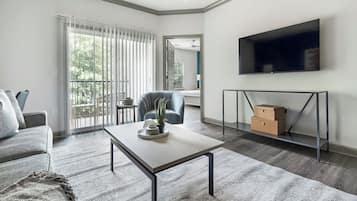 Apartment, 2 Bedrooms | Living area | 50-inch TV with digital channels