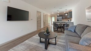 Apartment, 2 Bedrooms, 2 Bathrooms | Living area | 50-inch TV with digital channels