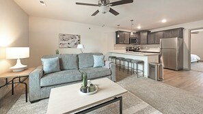 Apartment, 1 Bedroom | Living area | 50-inch TV with digital channels