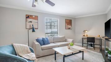 Apartment, 1 Bedroom | Living area | 50-inch TV with digital channels