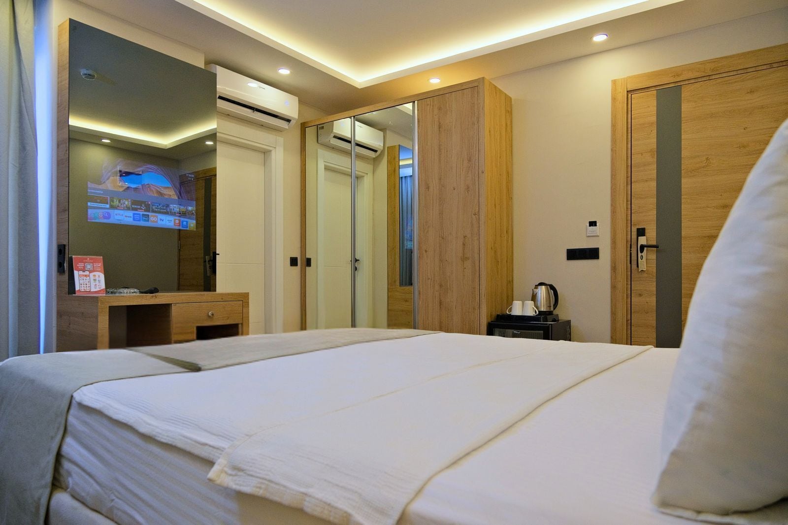 Premium bedding, desk, laptop workspace, free WiFi