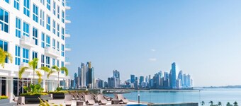 The Point – Stylish 2-BR w/ Pool, Gym , Private Balcony & Free Parking