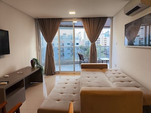 Basic Apartment | Living area | 38-inch Smart TV with satellite channels