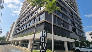 A modern multi-story building with a prominent 'MOVE' sign in front. - Flat Tambaú aproveite com sua família  (Joao Pessoa)