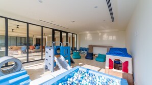 A spacious indoor play area with a ball pit, slides, and a playhouse. - Zantamar 502 C (La Cruz de Huanacaxtle)