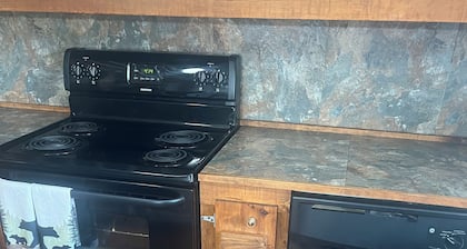 Marvelous cabin with fenced in yard in charming Stamps Arkansas