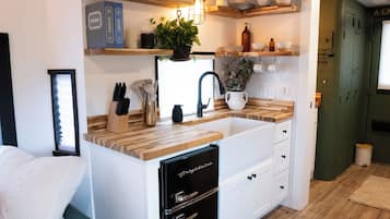 Fridge, microwave, coffee/tea maker, cookware/dishes/utensils