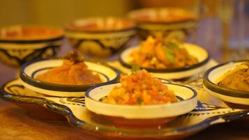 A table with various dishes in traditional serving bowls.