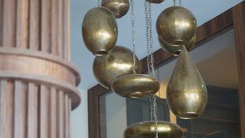 A ceiling with a decorative brass chandelier.