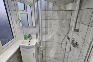 Shower, towels, soap, toilet paper