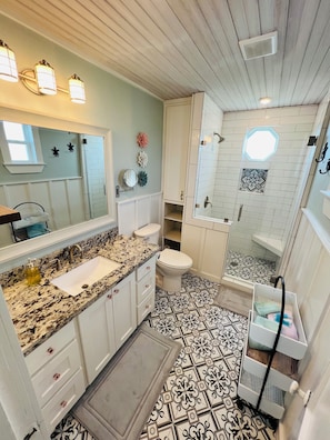 Shower, hair dryer, towels, soap