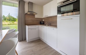 Fridge, stovetop, dishwasher, coffee/tea maker
