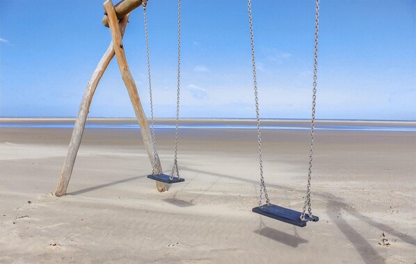 A beach with two wooden swings. - Amazing home in Kamperland with WiFi (Kamperland)