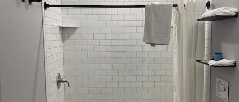 Shower, towels, soap, toilet paper