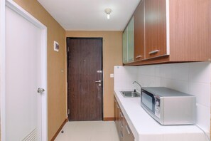 Standard Studio | Private kitchen - Nice And Minimalist Studio At Park View Condominium Apartment (Depok)