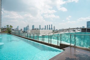 A rooftop swimming pool with a city skyline view. - Best Price And Elegant 2Br At Menteng Park Apartment (Jakarta)