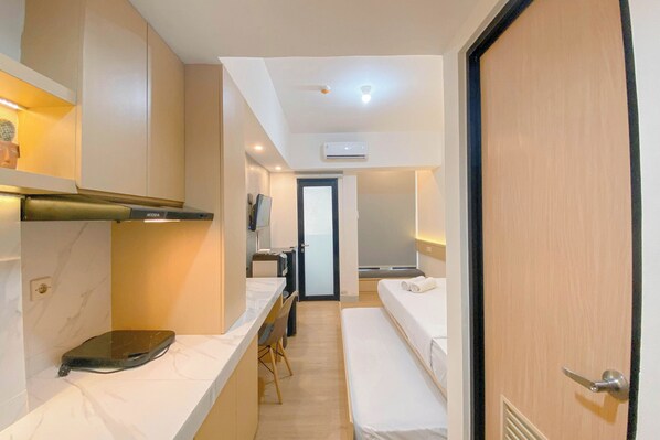 Standard Apartment | Private kitchen - Warm Minimalist Studio Apartment The Alton (Semarang)