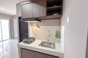 Standard Apartment | Private kitchen - Modern Minimalist 2Br Apartment At Suncity Residence (Sidoarjo)